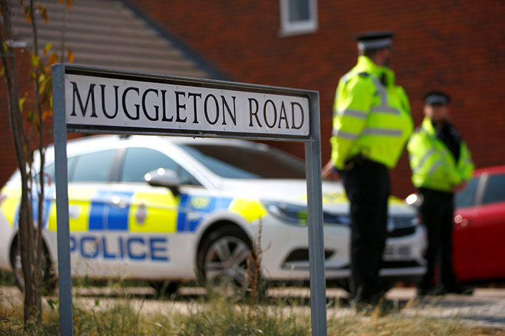 Police officers guard the entrance to a housing estate on Muggleton Road, after it was confirmed that two people had been poisoned with the nerve-agent Novichok, in Amesbury, Britain, July 5, 2018. 