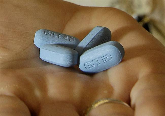 FILE - A doctor holds Truvada pills (also known as PrEP – or pre-exposure prophylaxis).