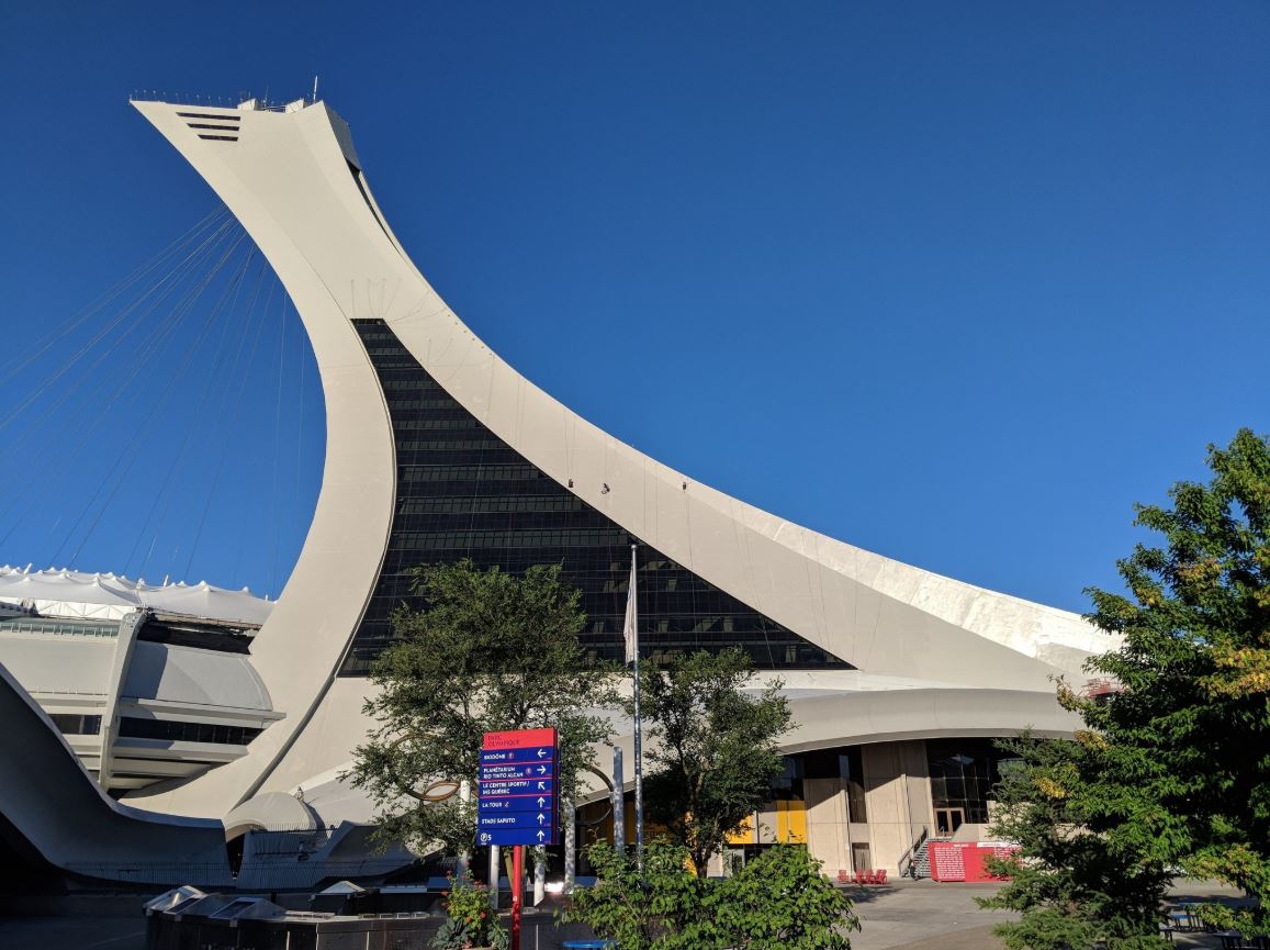 Greenpeace activists scale Montreal's Olympic Stadium to protest the Trans Mountain pipeline.