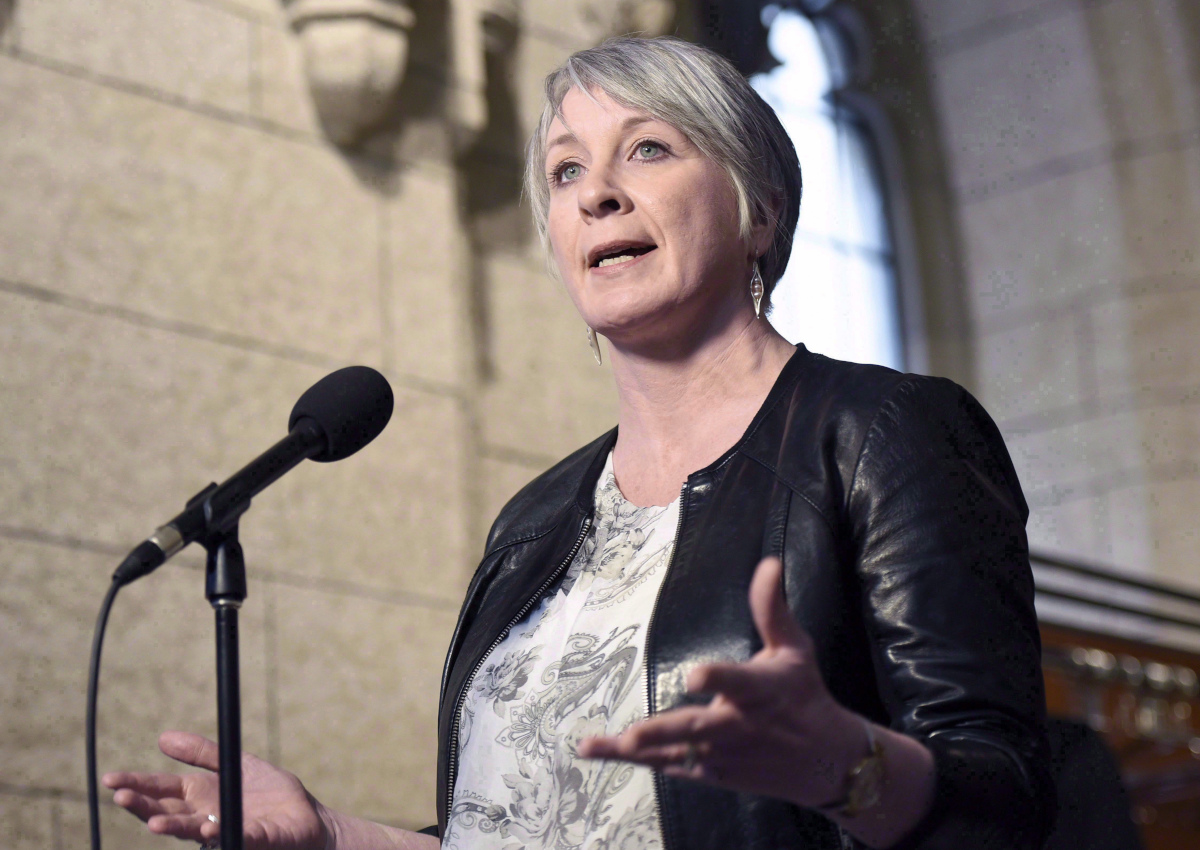 Minister of Employment, Workforce Development and Labour Patty Hajdu speaks to reporters during a weekend meeting of the national caucus on Parliament Hill in Ottawa on March 25, 2017.