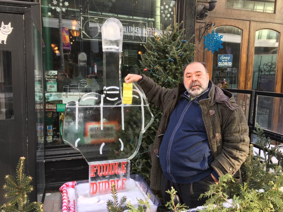 Al Carbone stands with an ice sculpture that he placed outside of his King Street restaurant in January to protest that street's pilot project.