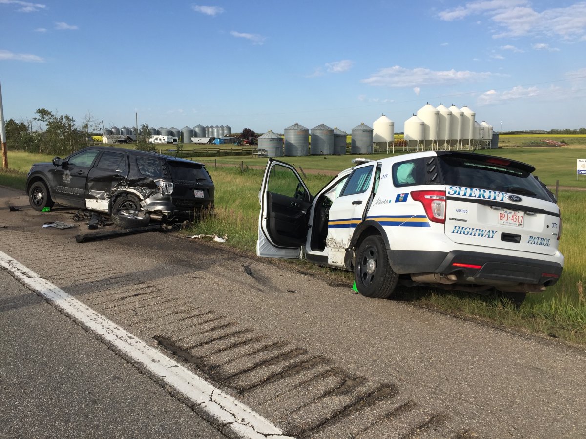 Two Alberta sheriff SUVs (pictured), an RCMP vehicle and a Lexus SUV were involved in the crash on the QEII, south of the Highway 2A overpass, Friday morning. July 20, 2018.
