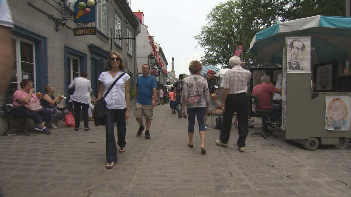 FILE: Tourists walk around in Old Quebec City  on Thursday, July 26, 2018.