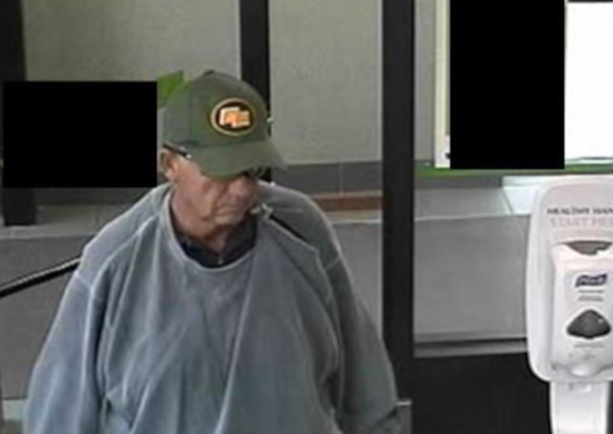Police are looking to speak with this man in connection to a robbery at a bank in Elmira.