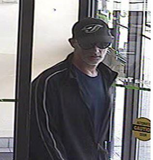 Halton police searching for bank robbery suspect. 