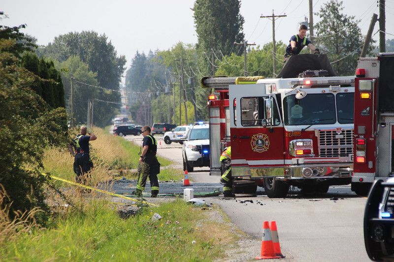Crews attend to the scene of a fatal crash in South Surrey Saturday morning.