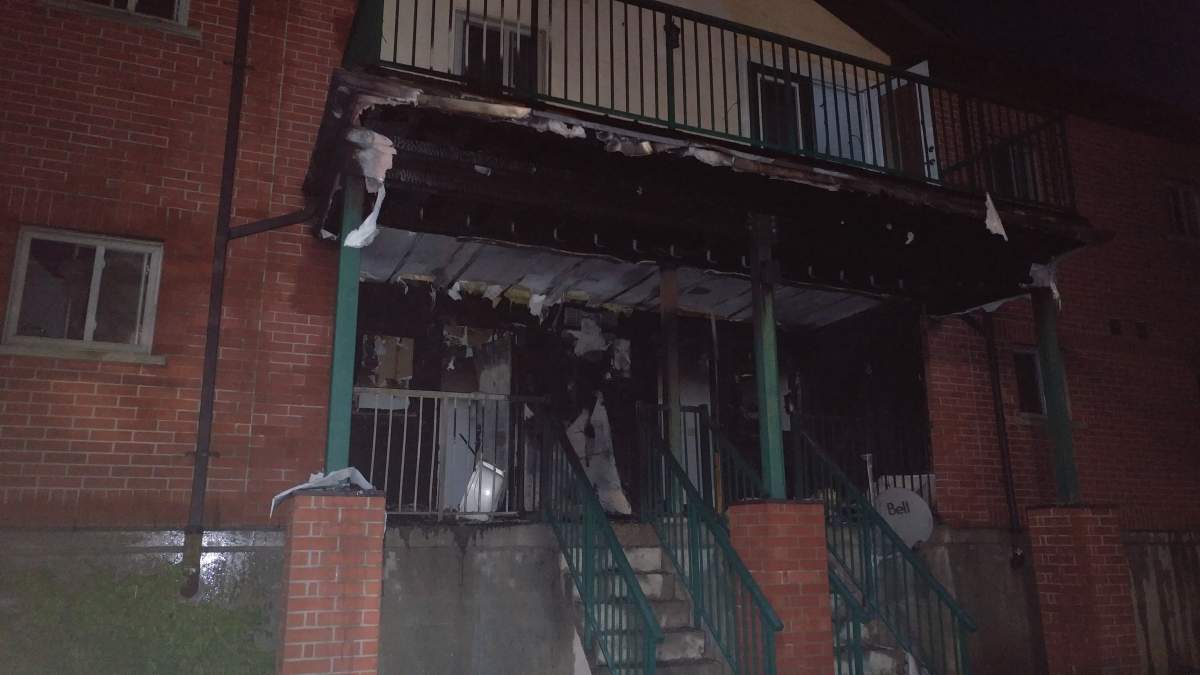 The front of units 13 and 14 at the Tol Puddle housing complex appear severely charred.