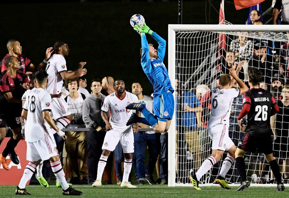 Toronto FC goalkeeper Clint Irwin (1) makes a save against the Ottawa Fury FC during second half Canadian Championship soccer action in Ottawa on Wednesday, July 18, 2018.