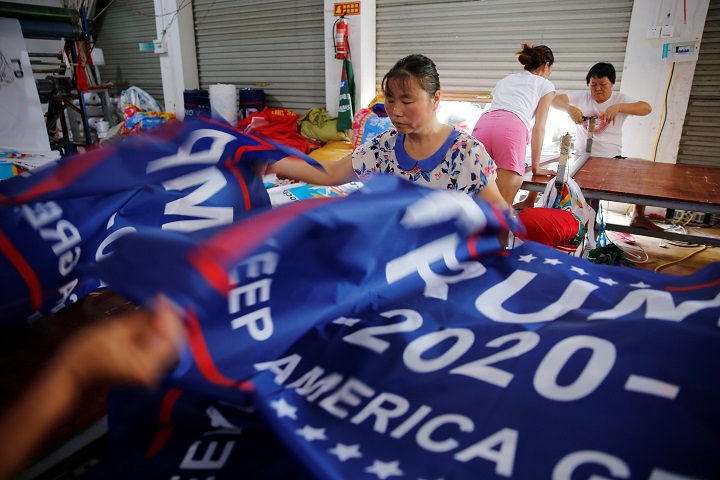 Workers make flags for U.S. President Donald Trump’s “Keep America Great!” 2020 re-election campaign at Jiahao flag factory in Fuyang, Anhui province, China July 24, 2018. Picture taken July 24, 2018.