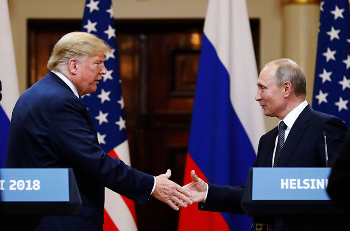 U.S. President Donald Trump shakes hand with Russian President Vladimir Putin at the end of the press conference after their meeting at the Presidential Palace in Helsinki, Finland, July 16, 2018. 