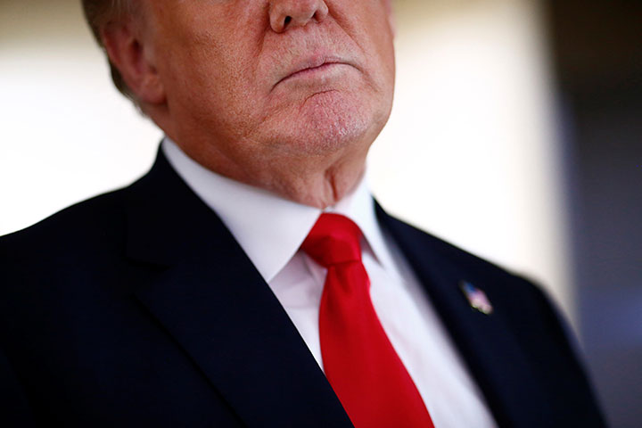 U.S. President Donald Trump speaks to the press aboard Air Force One en route to Bedminster, New Jersey, from Joint Base Andrews, Maryland, June 29, 2018. 