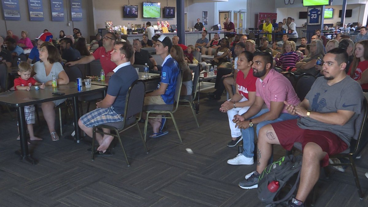 Valour FC fans gather at Investors Group Field to watch the 2018 FIFA World Cup final between France and Croatia .