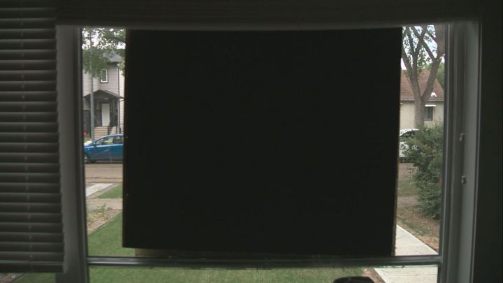 A damaged window is covered up at an Edmonton home. Police are asking the public for tips as they investigate a "widespread" vandalism spree in west Edmonton that affected about 50 residents.