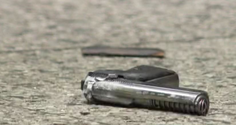A handgun observed behind police tape in downtown Vancouver on Thursday. 