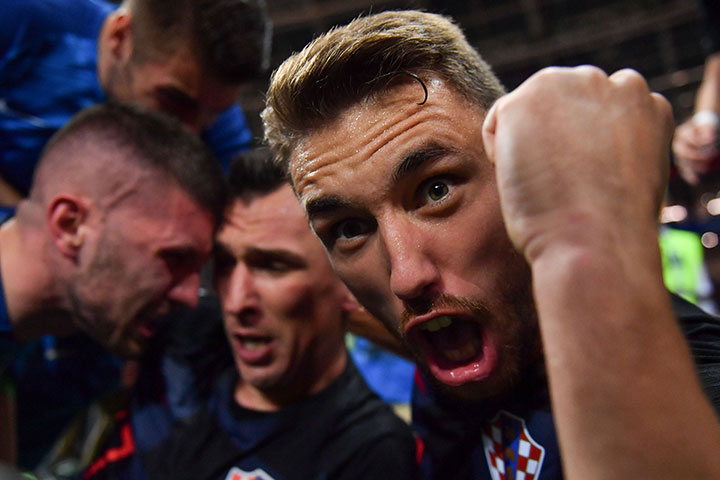 Croatia’s defender Josip Pivaric celebrates with teammates after Croatia’s forward Mario Mandzukic (C) scored their second goal during the Russia 2018 World Cup semi-final between Croatia and England at the Luzhniki Stadium in Moscow on July 11, 2018.