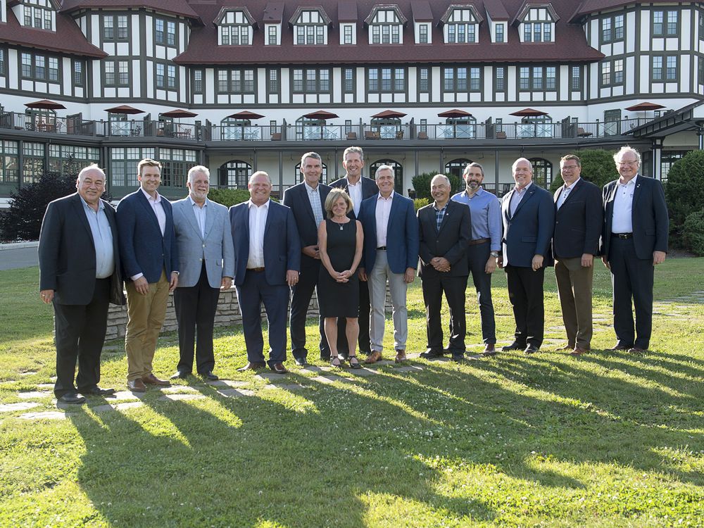 Visiting premiers pose for an official photo on the lawn of the Algonquin Resort as the Canadian premiers meet in St. Andrews, N.B., on Wednesday, July 18, 2018. 