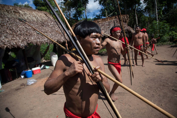 In this Sept. 7, 2012 file photo, Yanomami Indians dance in their village called Irotatheri in Venezuela's Amazon region. 