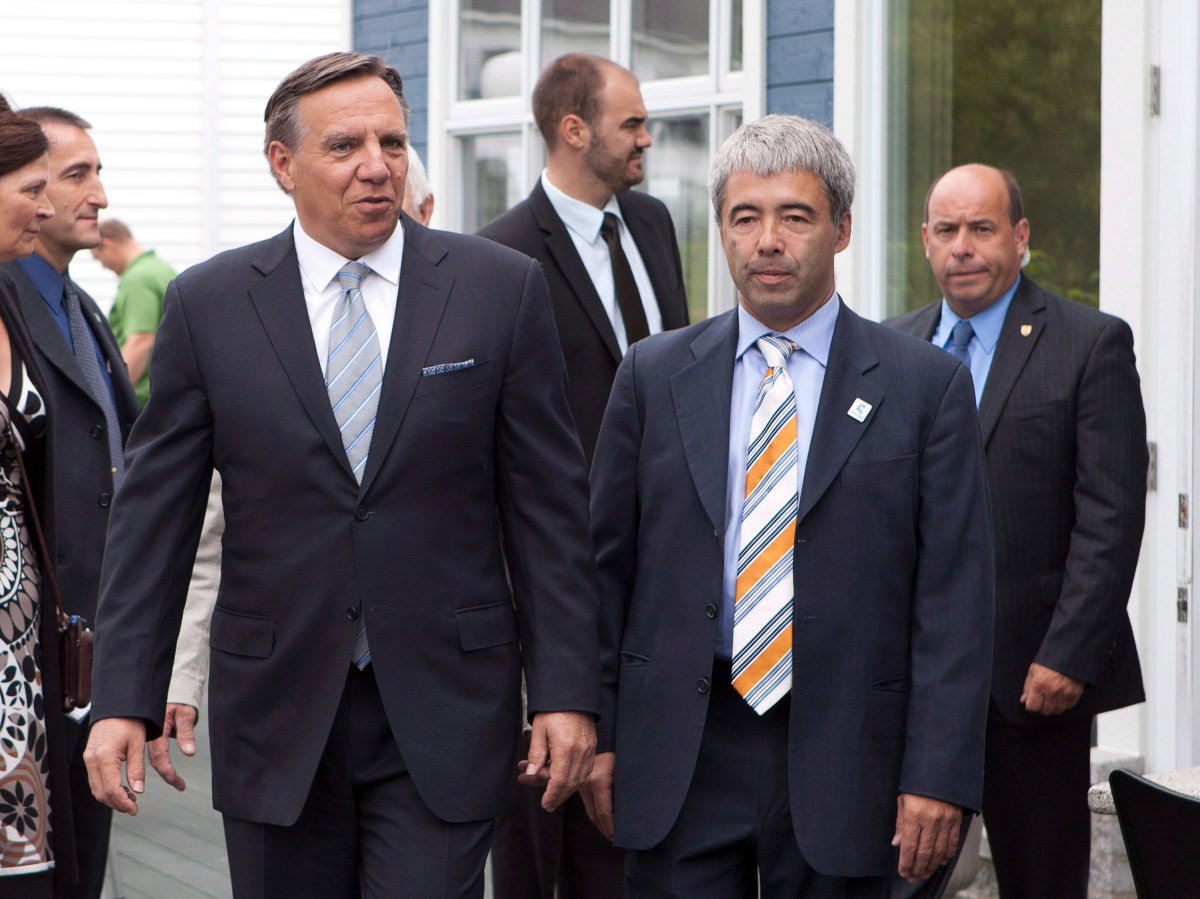 Coalition Avenir Quebec's Stéphane Le Bouyonnec, right, has resigned as president of the party.