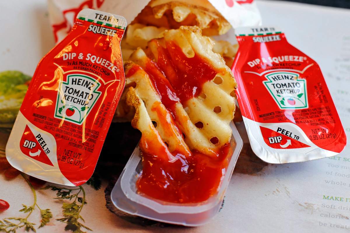 FILE - This Monday, March 30, 2015, file photo shows Heinz Tomato Ketchup in dip-and-squeeze containers at a Robinson Township, Pa.