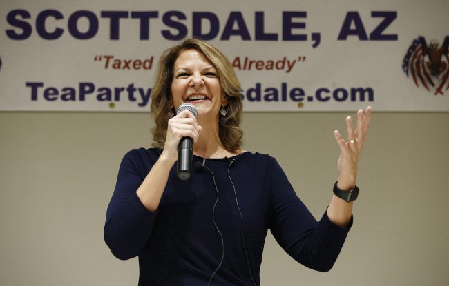 In this May 17, 2018, photo, Republican Senate candidate Kelli Ward talks about her platform policies at a Scottsdale Tea Party event in Scottsdale, Ariz. 

