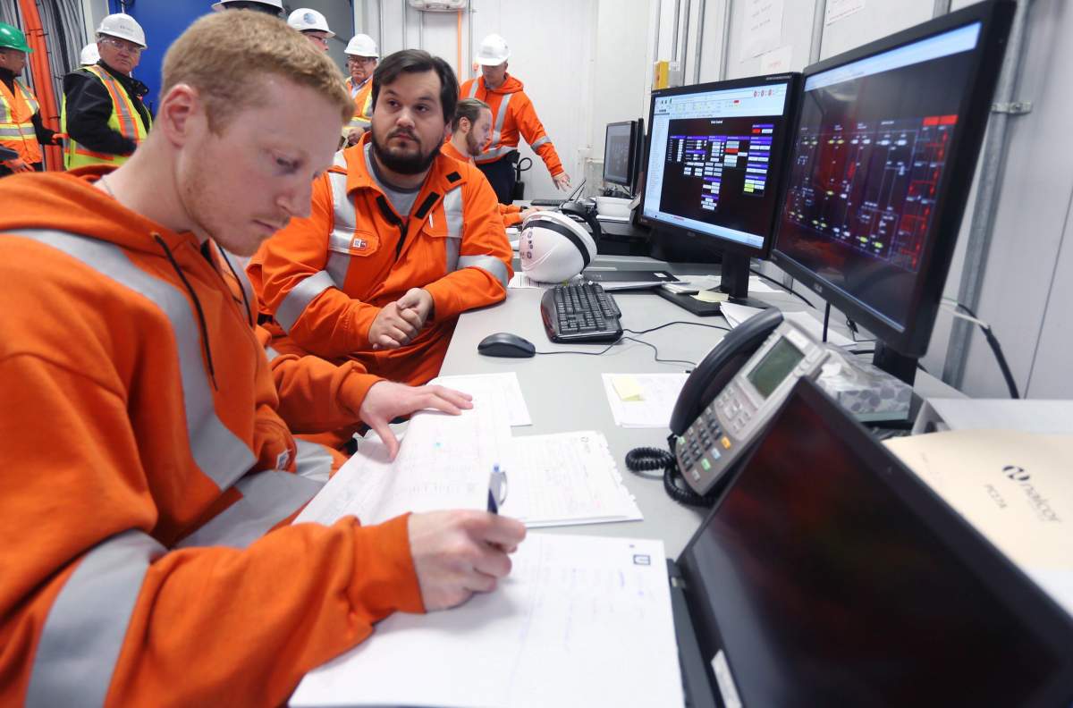 Trevor Tobin, left, and Sandy Goodyear work in the Control Room at the Lower Churchill Soldiers Pond site, 40 minutes outside of St. John's on Wednesday, June 27, 2018. 