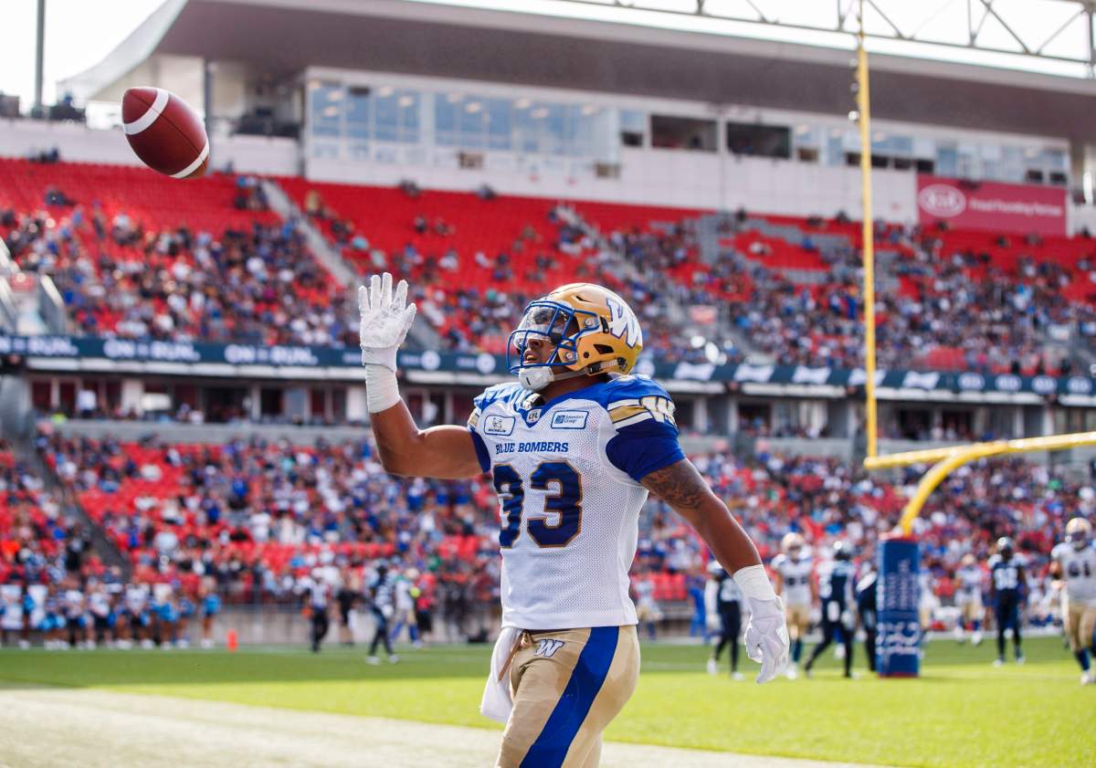 Winnipeg Blue Bombers' Andrew Harris celebrates his touchdown during first half CFL football action against the Toronto Argonauts, in Toronto on Saturday, July 21, 2018.