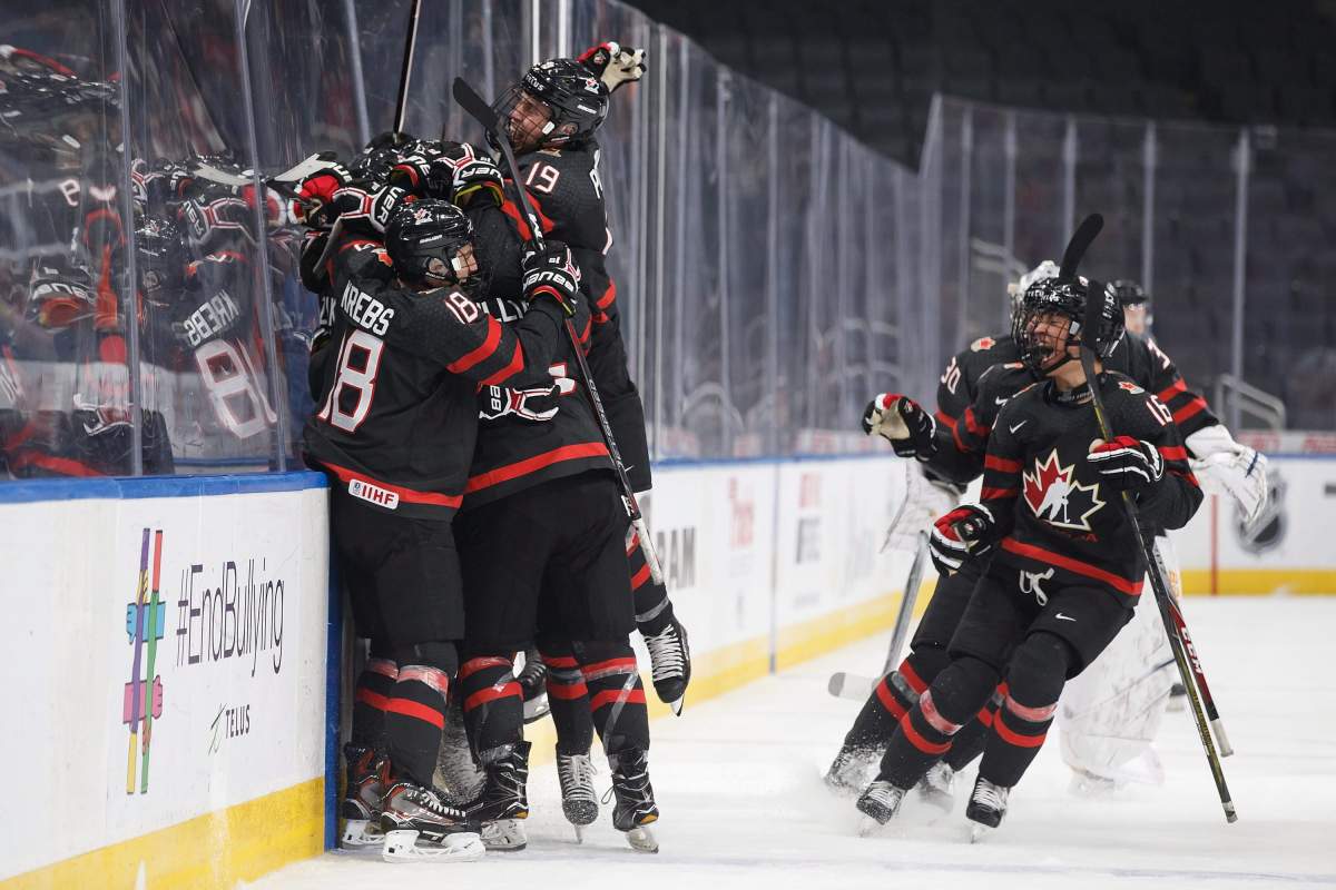 Canada celebrates the game-winning goal during overtime Hlinka Gretzky Cup semifinal action against the United States, in Edmonton on Friday.