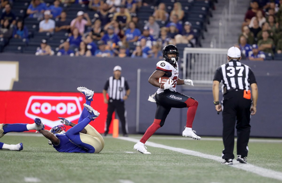 Ottawa Redblacks' William Powell (29) scores a touchdown behind Winnipeg Blue Bombers' Kevin Fogg (3) during the second half in Winnipeg on Friday, Aug. 17, 2018.