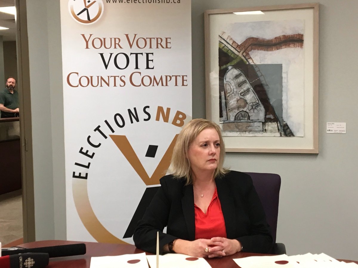 New Brunswick Chief Electoral officer Kimberly Poffenroth looks on ahead of signing the writs for the Sept. 24 provincial election in Fredericton on Wednesday, Aug. 22, 2018. 