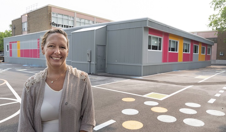 Marie-José Mastromonaco, vice-president of the Montreal School Board, is seen next to temporary classrooms at the Saint-Gabriel-Lalemant in Montreal on Friday, August 24, 2018. 