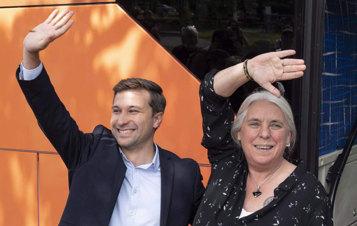 Québec Solidaire co-spokesperson Gabriel Nadeau-Dubois and Manon Massé wave to supporters as they arrive to launch their campaign in Montreal. The party has found its support in the same urban ridings where the Parti Quebecois started in the 1970s, among young and educated francophones who want to transform Quebec society.