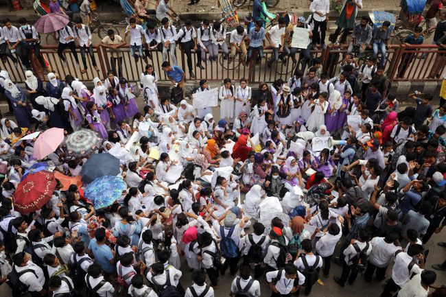 Students blockade a road as they take part in a protest over recent traffic accidents that killed a boy and a girl, in Dhaka, Bangladesh, August 4, 2018.
