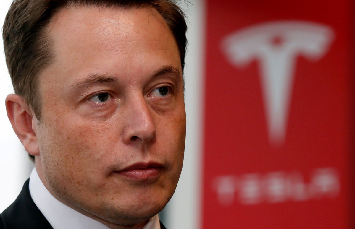 Tesla Motors Inc Chief Executive Elon Musk pauses during a news conference in Tokyo September 8, 2014.    