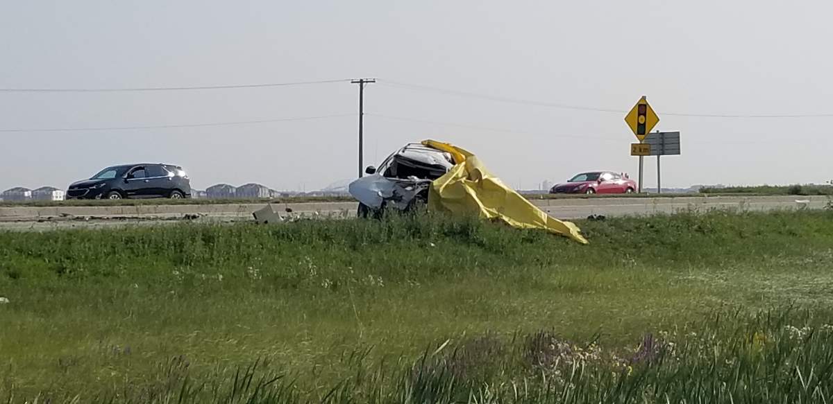 A tarp covers a truck involved in a serious crash near Brady Road. 