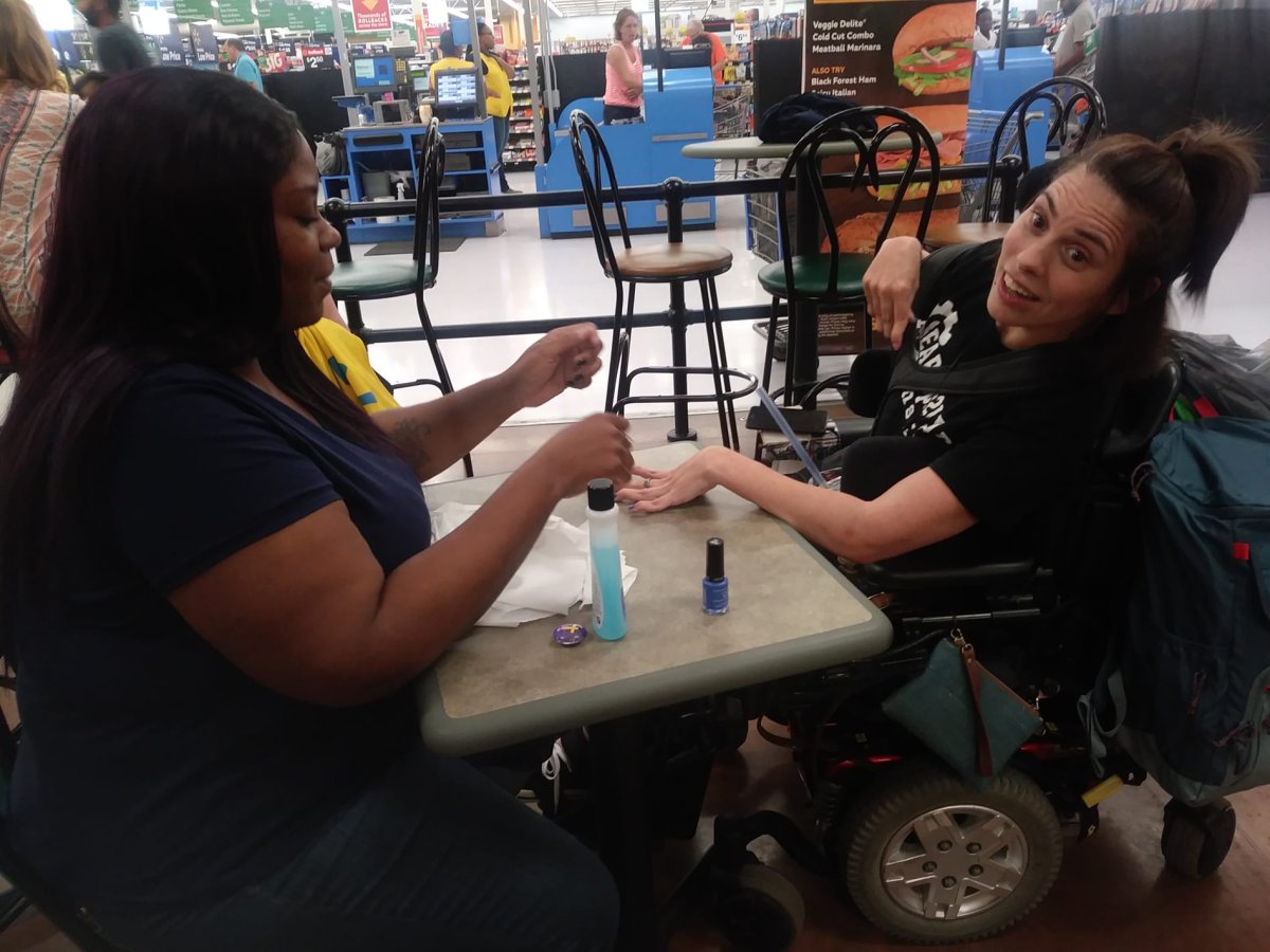 After being turned away at a nail salon in a Walmart in Michigan, Angela Peters met a complete stranger who offered to do her nails. 