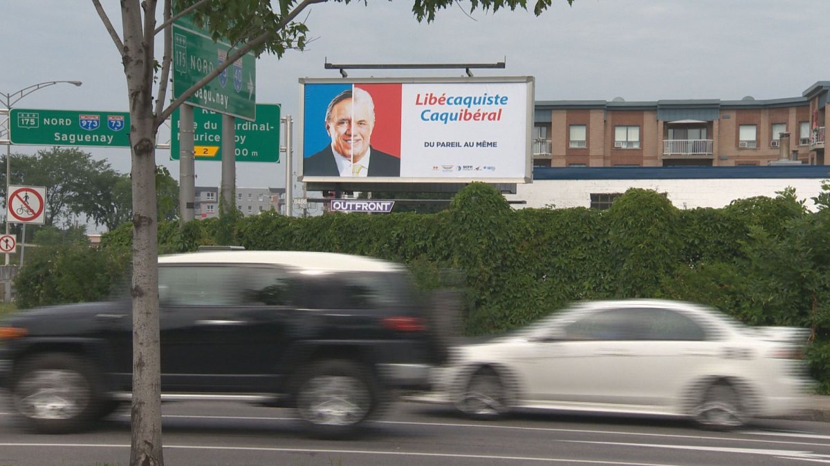 A group of unions representing 116,000 employees have put up a number of posters in ridings across the province, where they believe it will be a tight race, like this one in Quebec City. Wednesday, August 1, 2018.