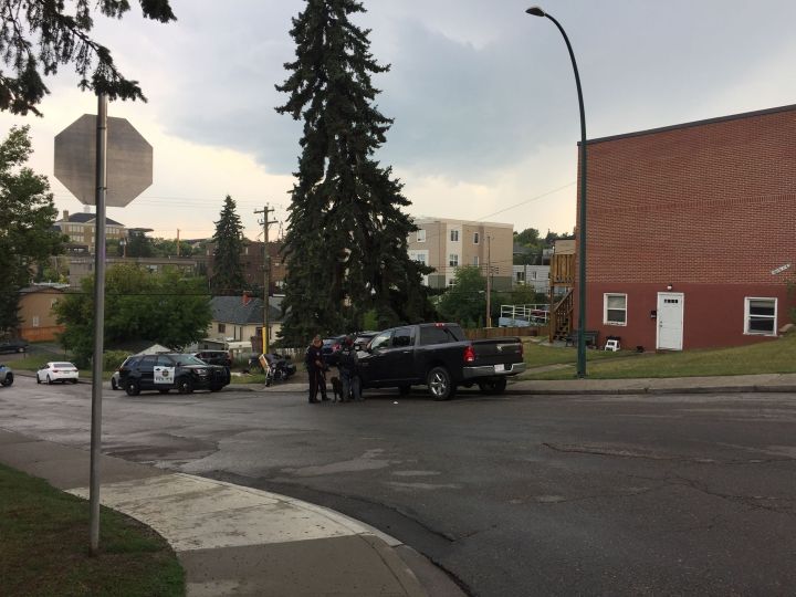 A man was taken into custody after police surrounded a small apartment building in the Calgary community of Bankview on August 2, 2018.