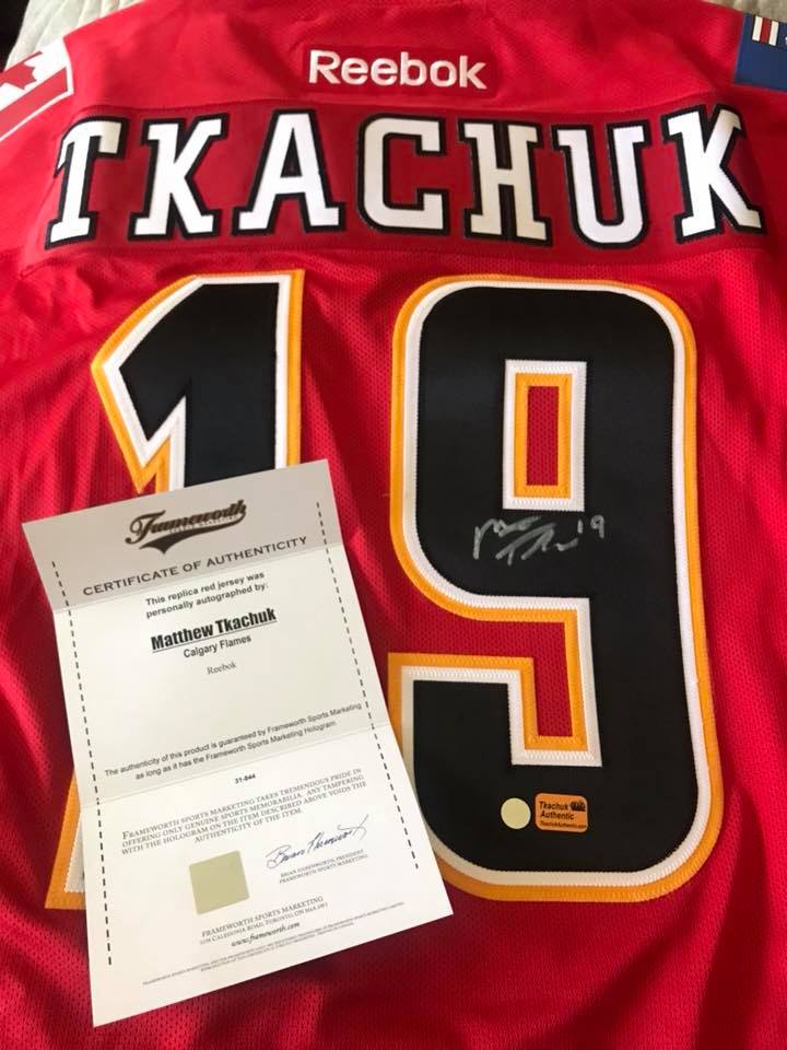 An autographed Calgary Flames jersey was raffled off to cover funeral costs.
