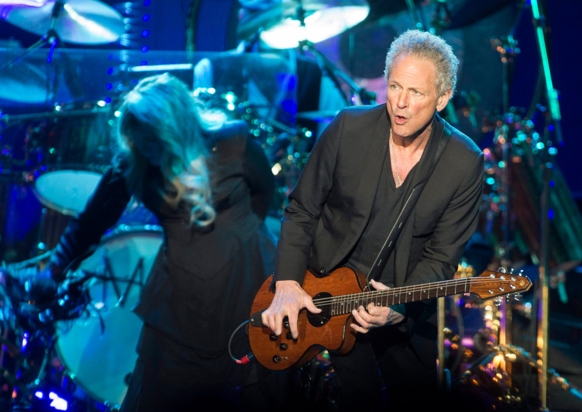 In this March 8, 2015 photo, Lindsey Buckingham, right, and Stevie Nicks of Fleetwood Mac perform during the On with the Show tour Sunday, March 8, 2015, in Knoxville, Tenn. 