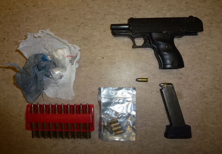 Police say a handgun, ammunition, crack cocaine and heroin were seized from the suspect.