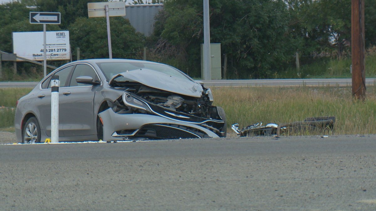 Roads in southwest Calgary were closed after a car versus motorcycle collision on Tuesday evening.