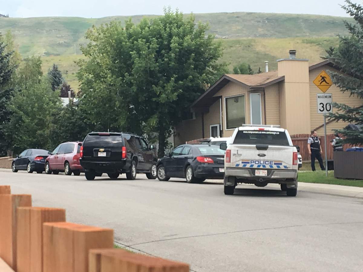 A large police presence could be seen outside a home in Cochrane on Friday.