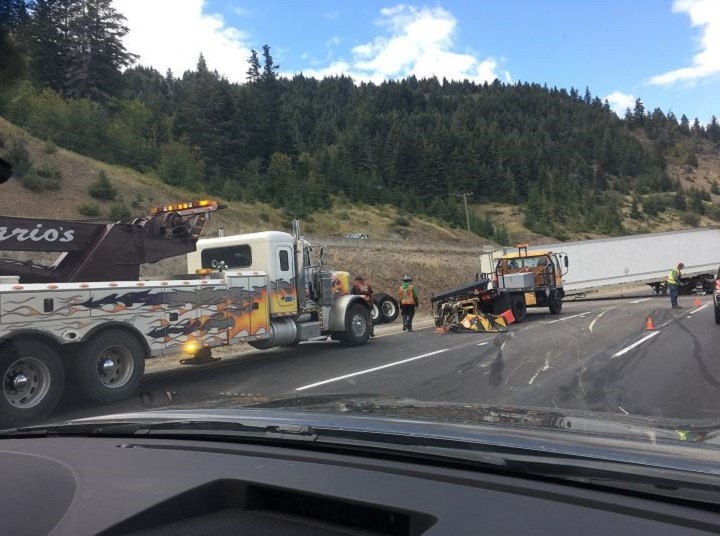 Workers recover a crashed semi in the northbound lanes of the Coquihalla near Exit 250, approximately 35 kilometres south of Merritt.