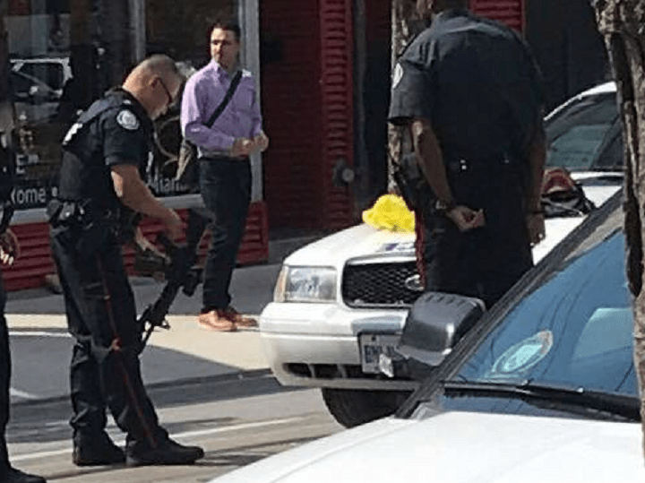Toronto police officers check out a replica gun a man in a cosplay outfit brought onto a streetcar.