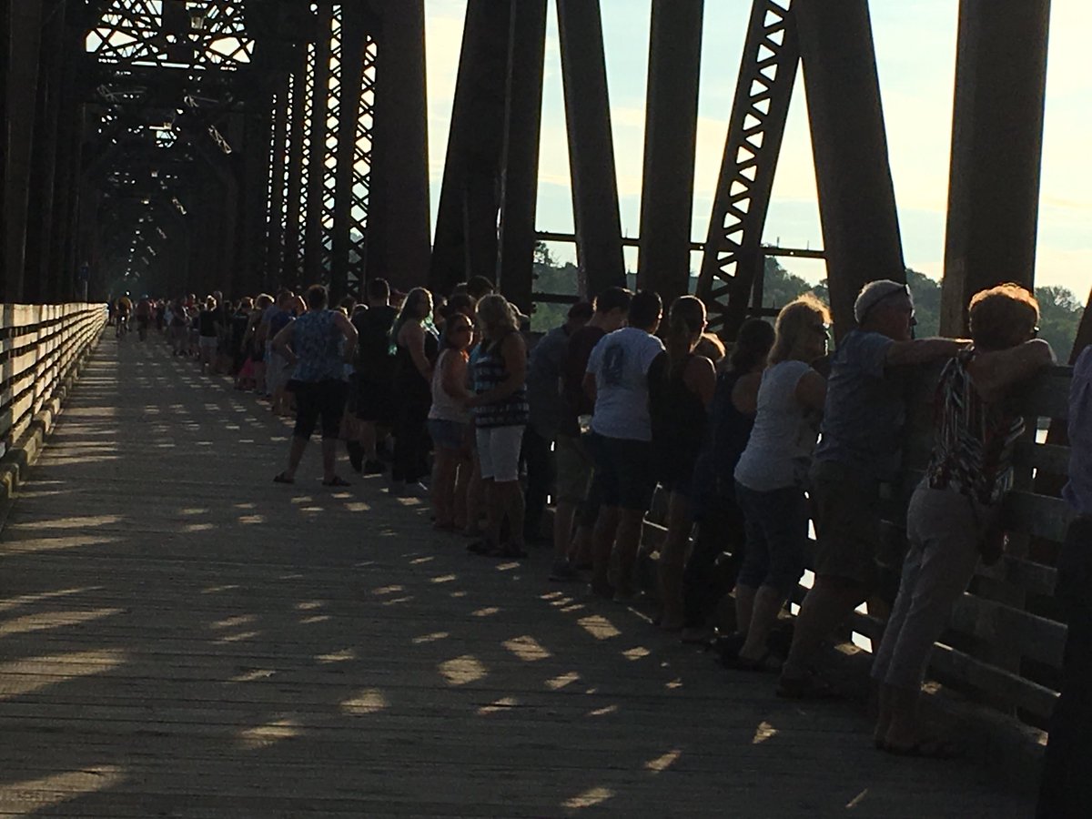 Tributes to the victims continued Monday evening as thousands of people turned out to express their grief, hold hands and show support for their city.
