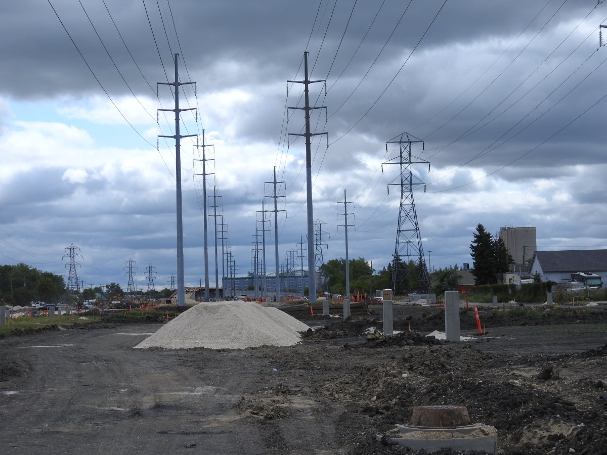 A pile of gravel directly underneath Manitoba Hydro transmission lines.