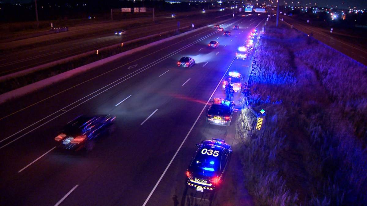 Police investigate the scene of a shooting at Hwy. 401 and Hwy. 403 in Mississauga on Aug. 26, 2018.