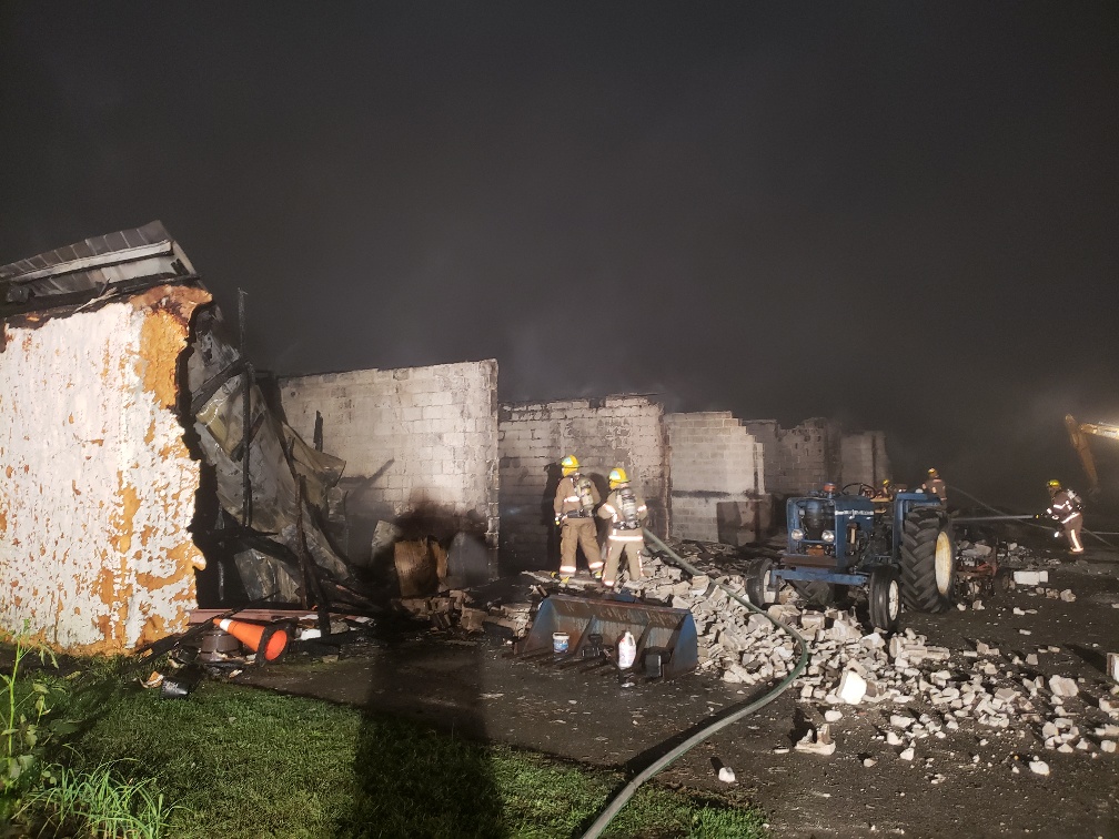 Barn fully engulfed by fire in Norfolk County.