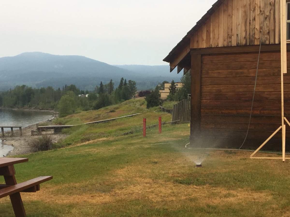 Sprinklers work to protect historic buildings at the Fort St. James national historic site. 