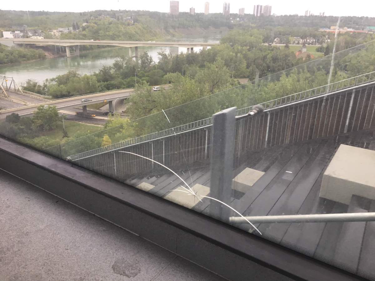 The glass wall of the funicular was broken roughly at foot height.